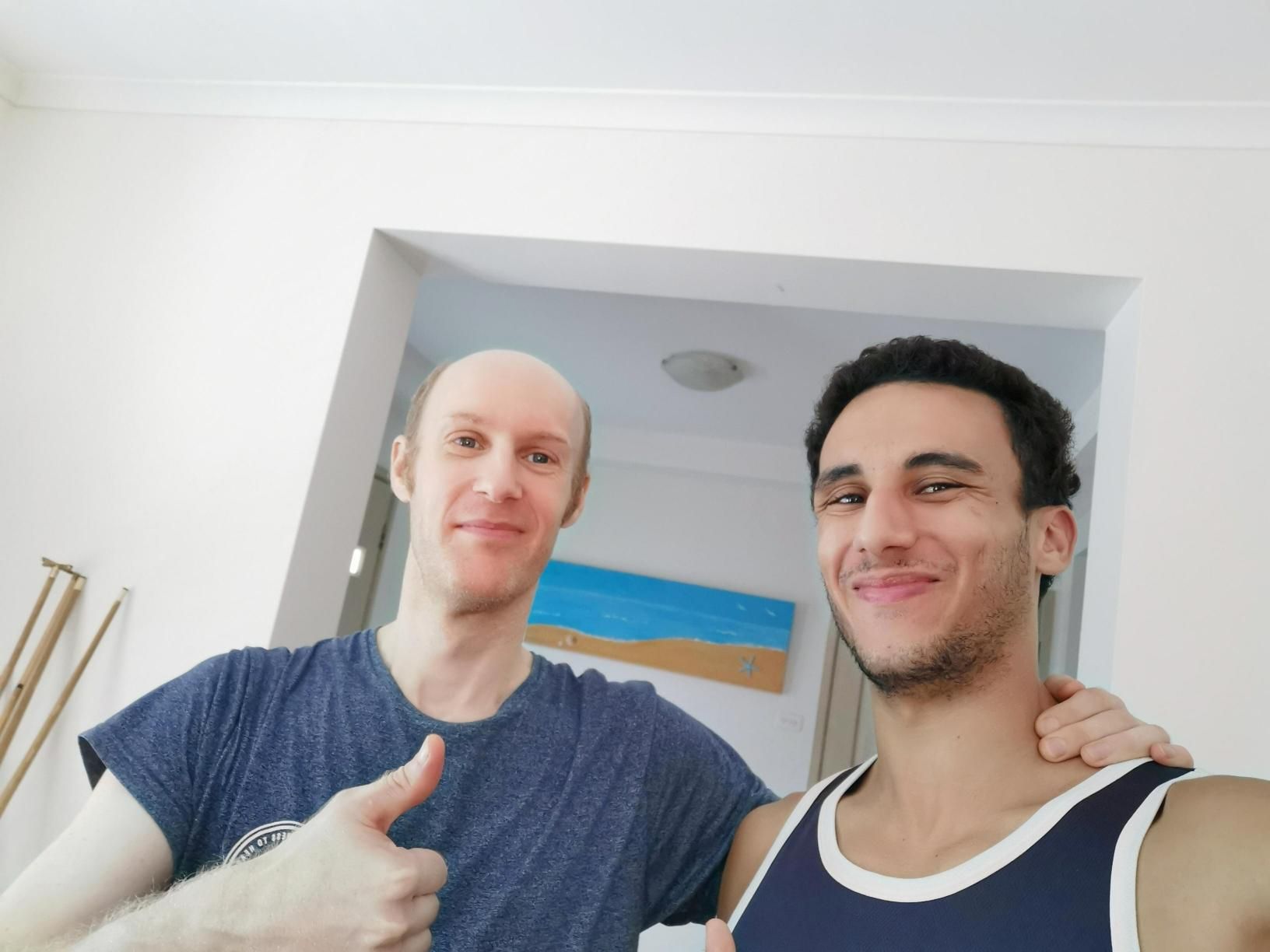 Two Men Are Posing for a Picture and One is Giving a Thumbs Up —True Form Fitness In Gwandalan, NSW