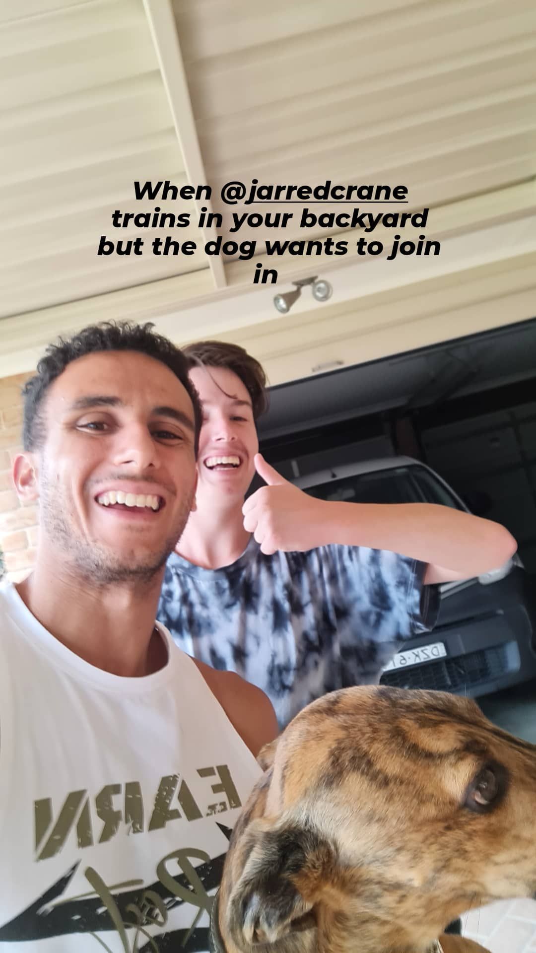 Two smiling men, a dog. One man in a white tank top. The other man gives a thumbs-up —True Form Fitness In Gwandalan, NSW