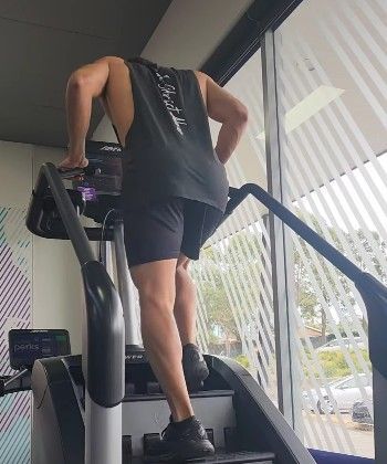 A Man is using a Treadmill in a Gym —True Form Fitness In Gwandalan, NSW