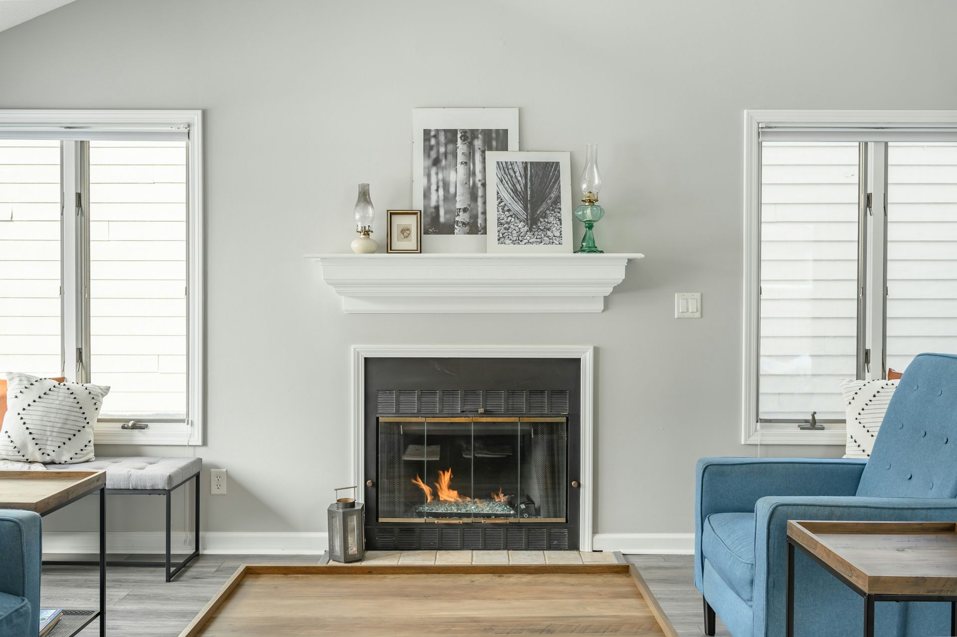 There is a fireplace in the middle of the living room.