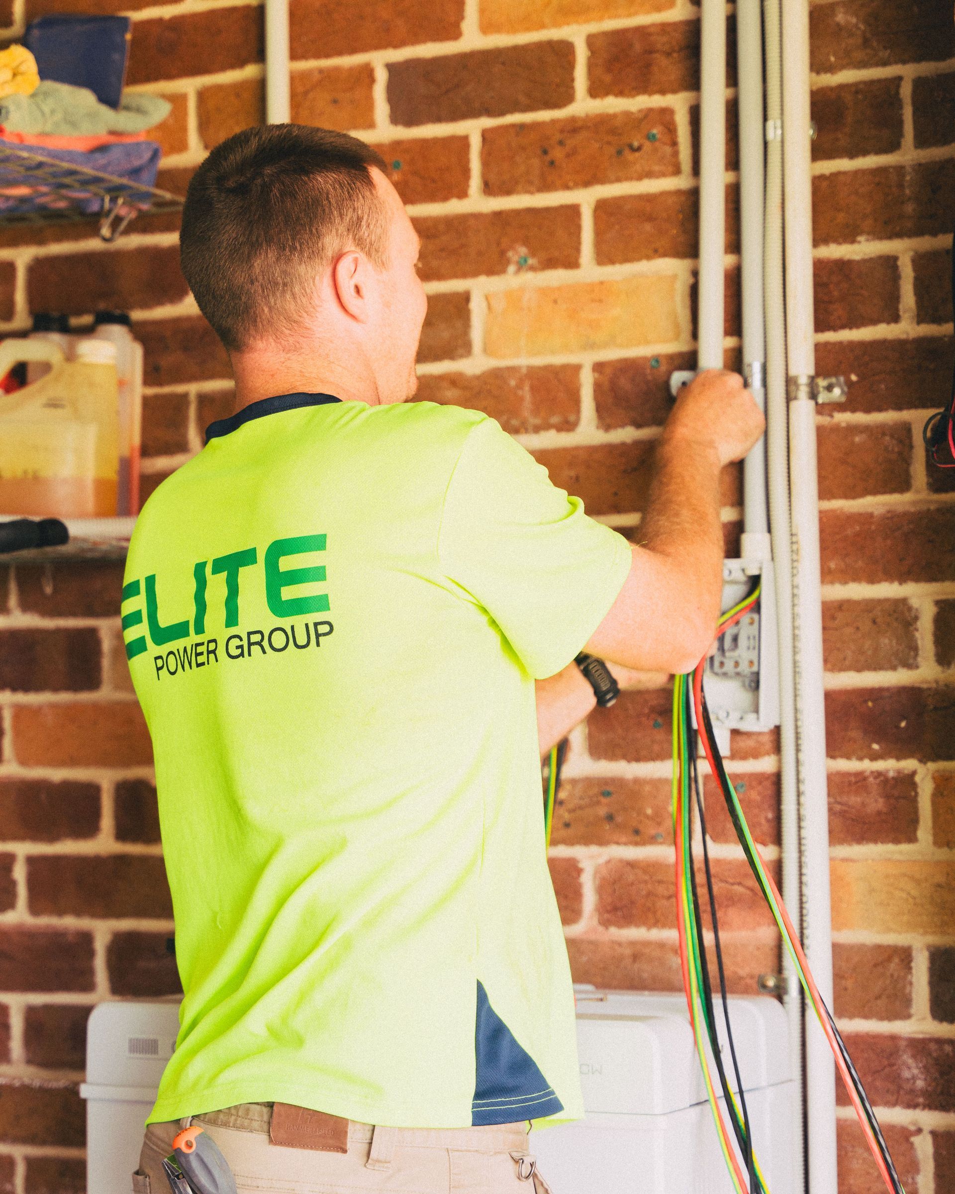 Technician installing a smart irrigation system line
