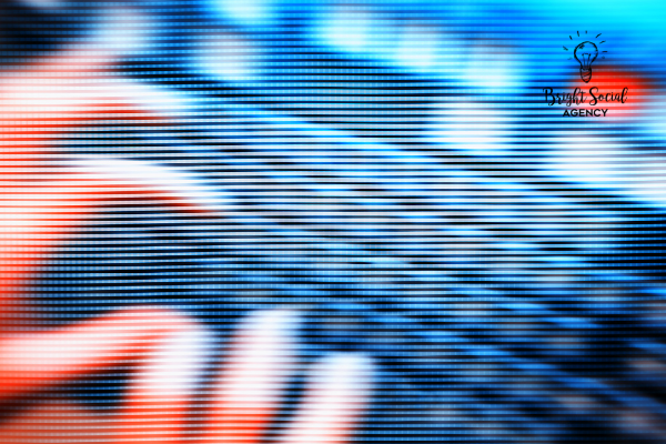 Hands blurred over a keyboard; red and blue light effect.