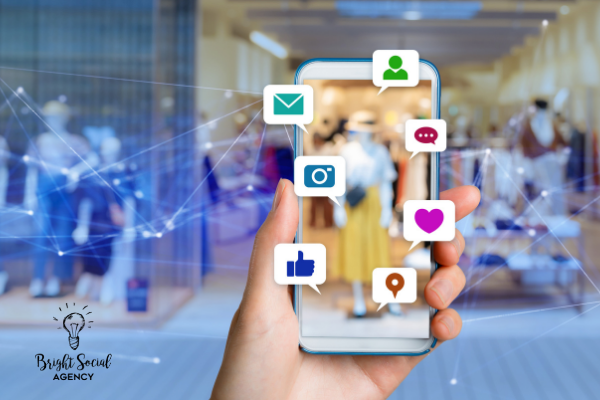 Hand holding phone displaying social media icons overlaid on store interior.