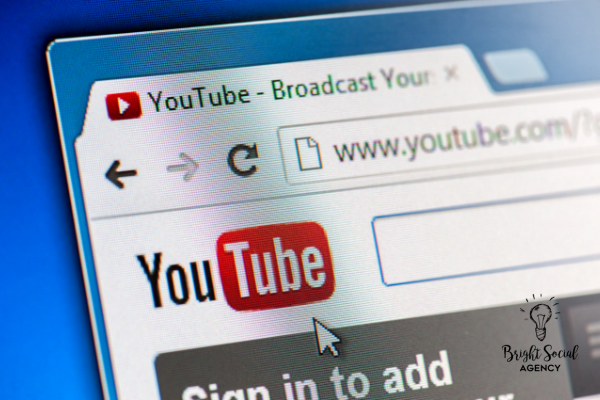 YouTube website on a computer screen.  Red YouTube logo visible. Website address www.youtube.com. Sign-in option.