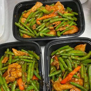 Three containers of green beans and orange chicken takeout meal prep