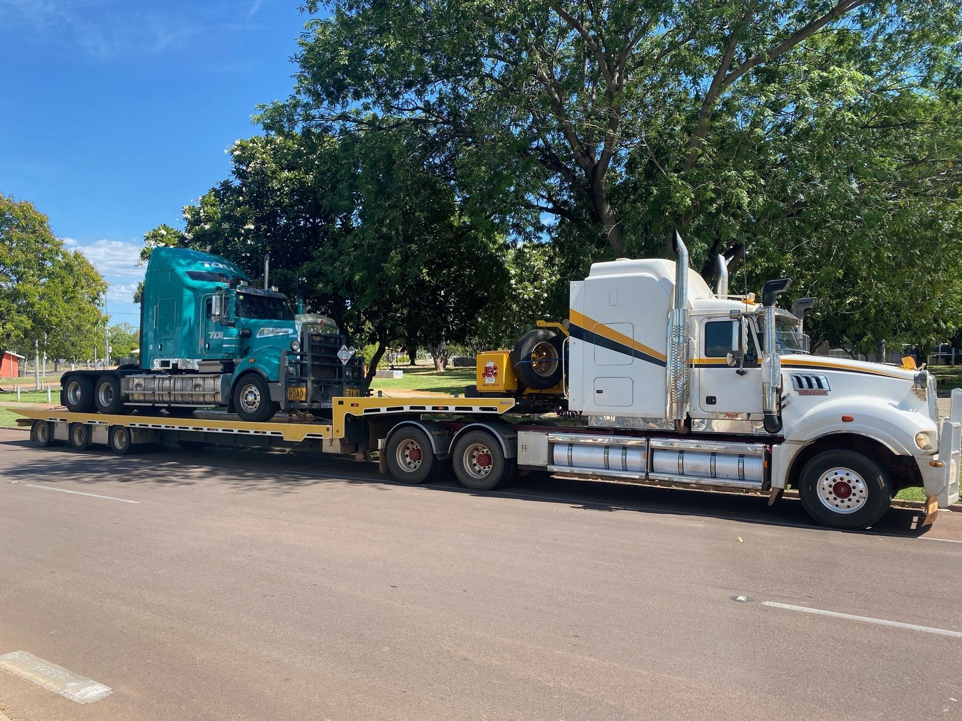 Emergency Tow Truck Parked Beside a Tree