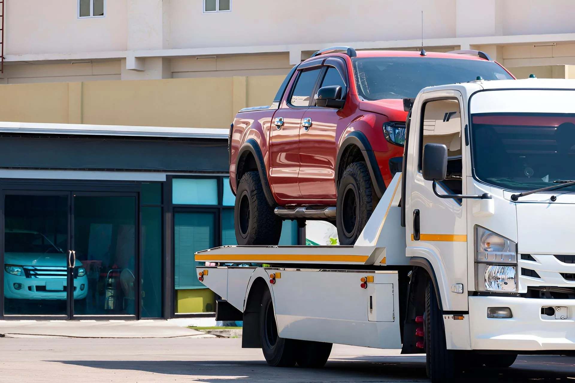 Tow Truck In Darwin Transporting Pickup Truck On Flatbed Carrier
