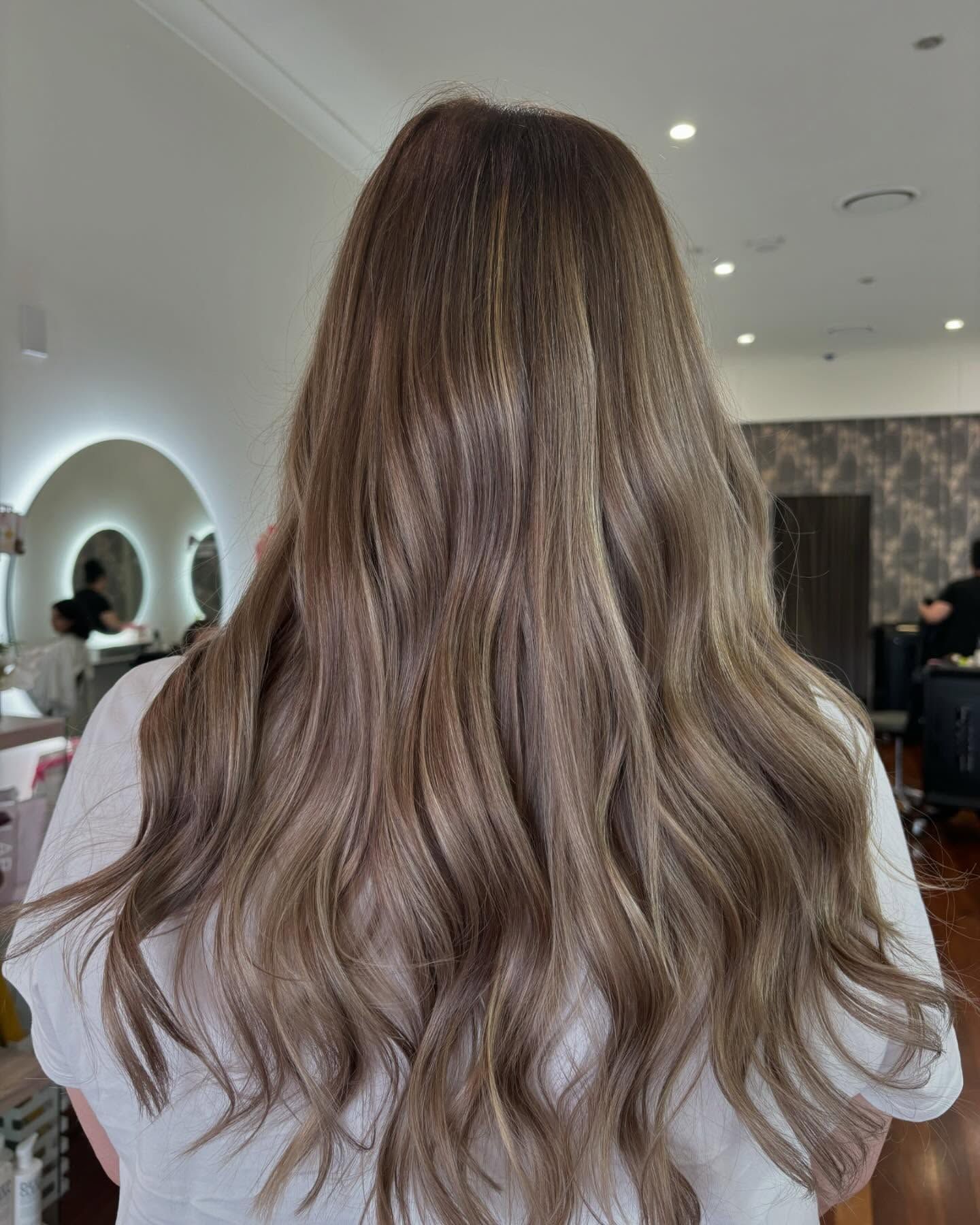 Long Wavy Brown Hair Styled in a Salon Chair, Viewed From Behind — Hair Truss & Co In Wallsend, NSW