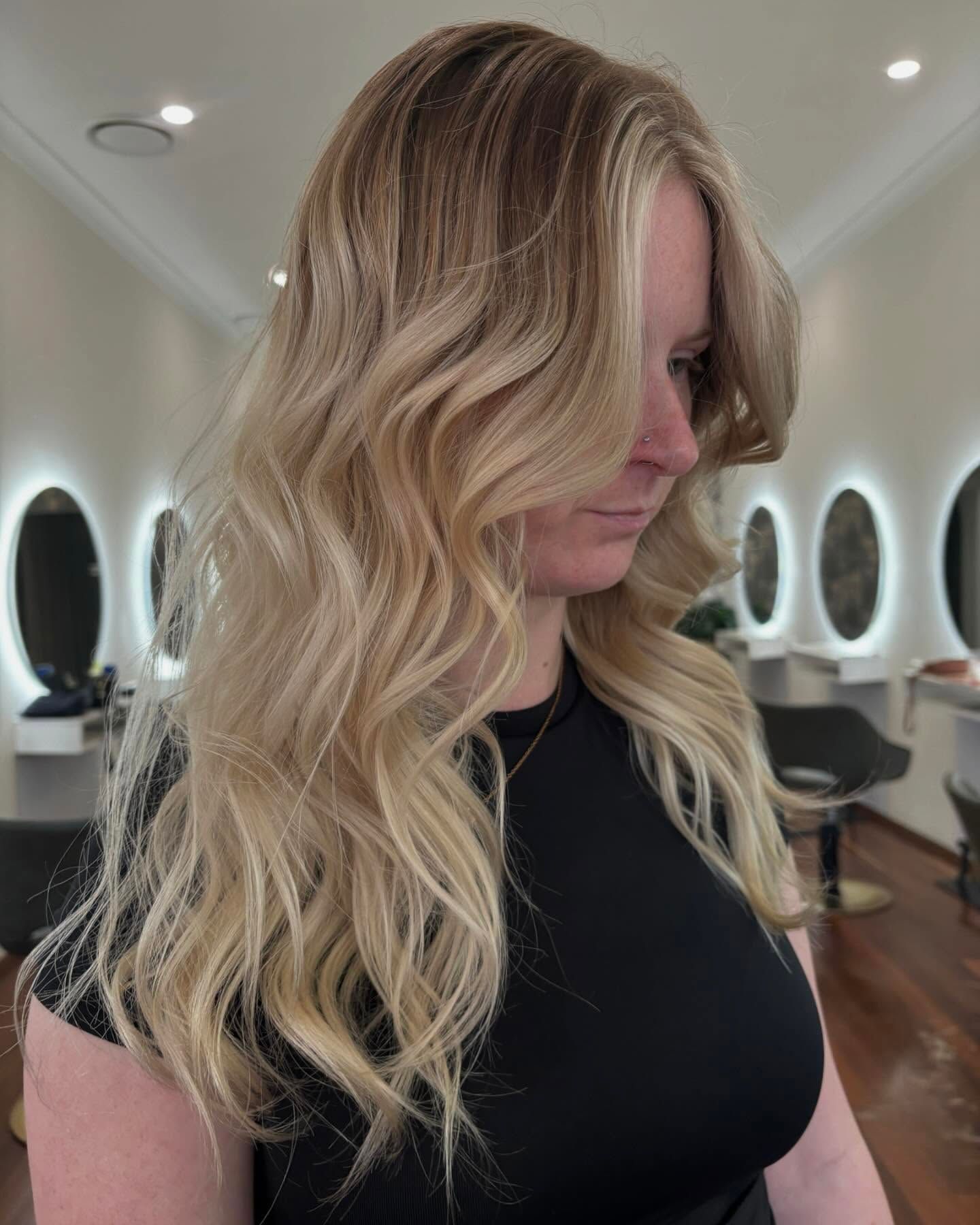 Elegant Side-profile Hairstyle With Curled Ponytail in a Bright Salon — Hair Truss & Co In Wallsend, NSW