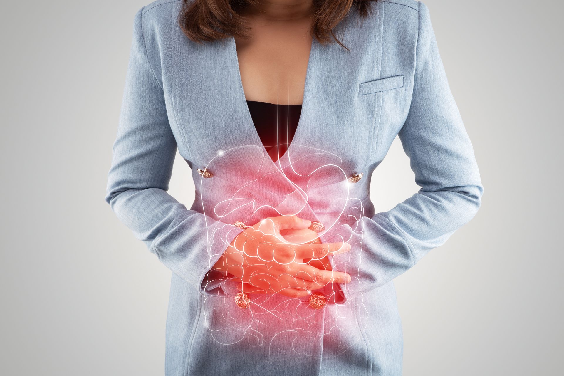 Woman holding her stomach due to constipation pain