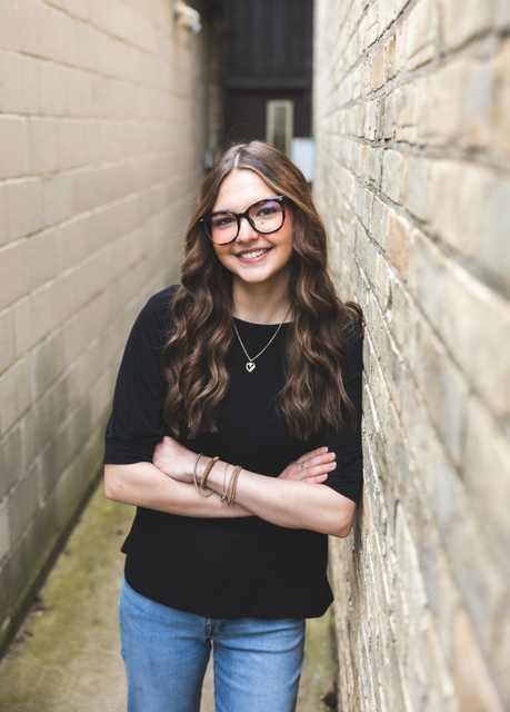 Headshot of Willow in brick alley