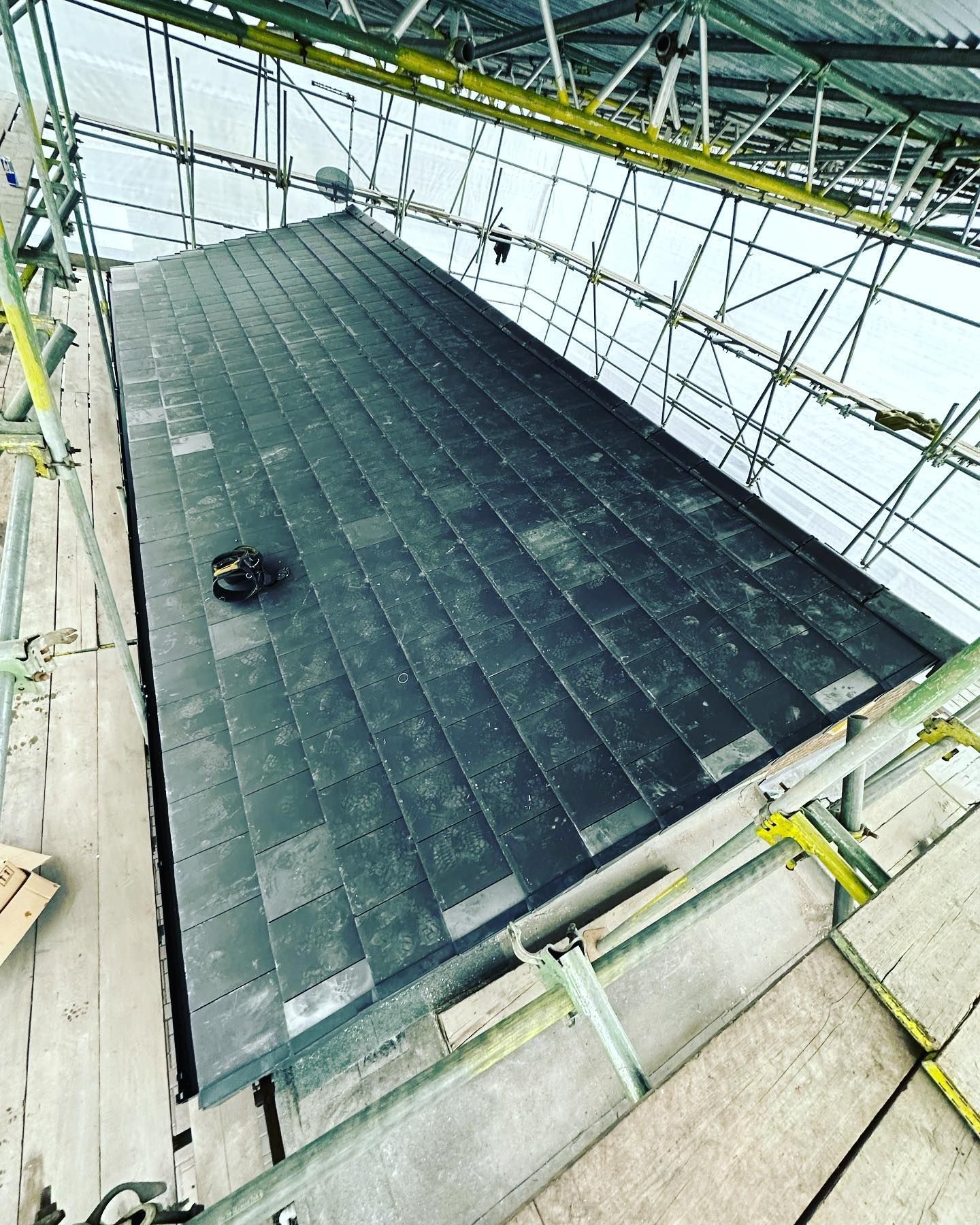 A picture of a slate roof replacement carried out by Roofers Barnsley