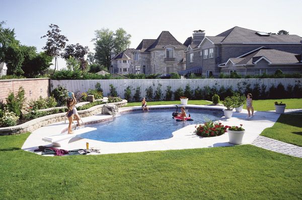 family enjoying an inground pool 
