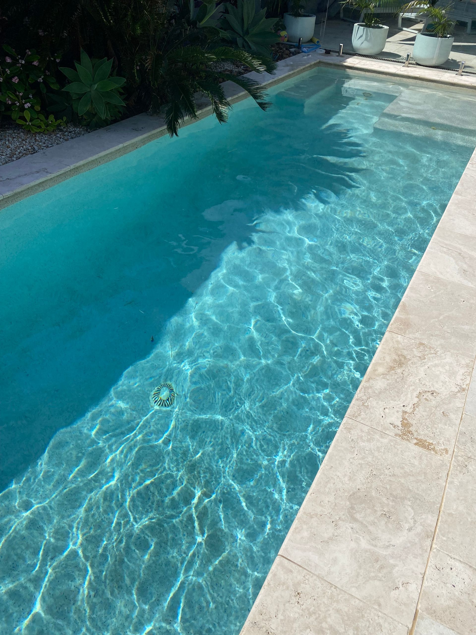 There is a Waterfall in the Middle of a Swimming Pool — Tweed Coast Pool Care in South Murwillumbah, NSW