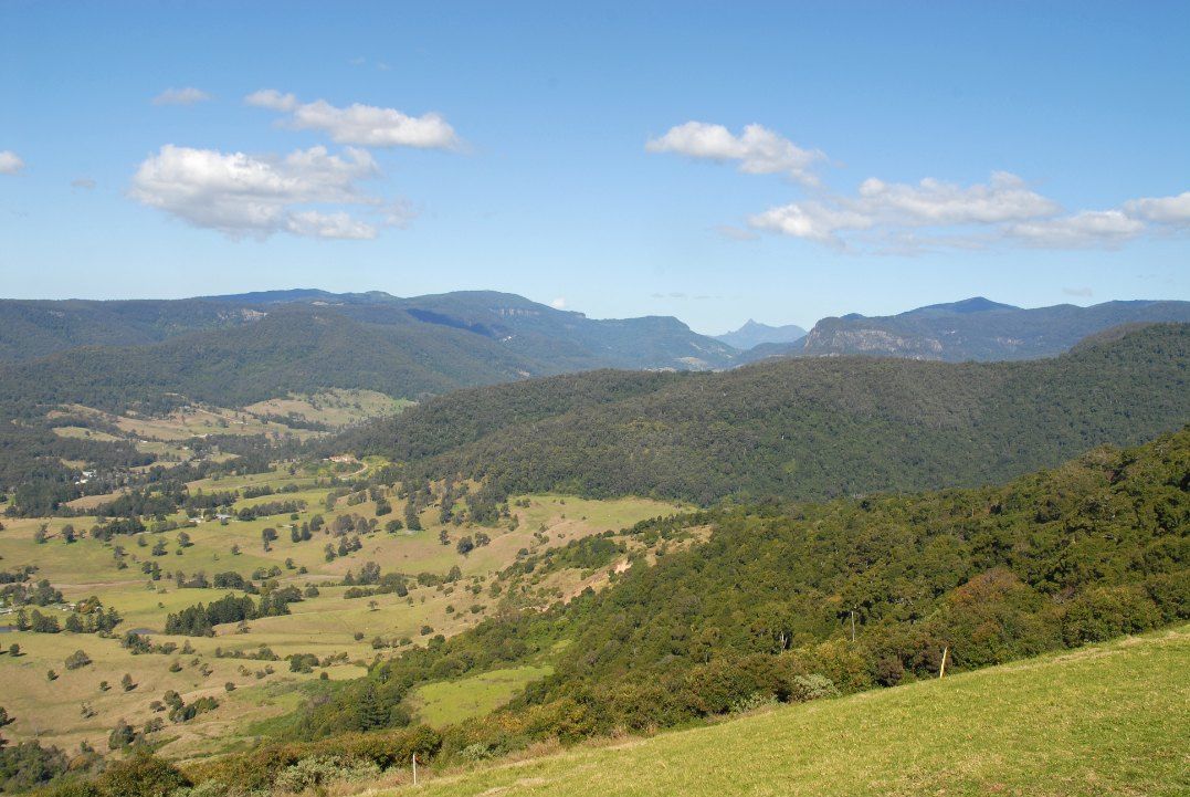 A View of a Valley With Mountains in the Background on a Sunny Day — Tweed Coast Pool Care in Numinbah, NSW