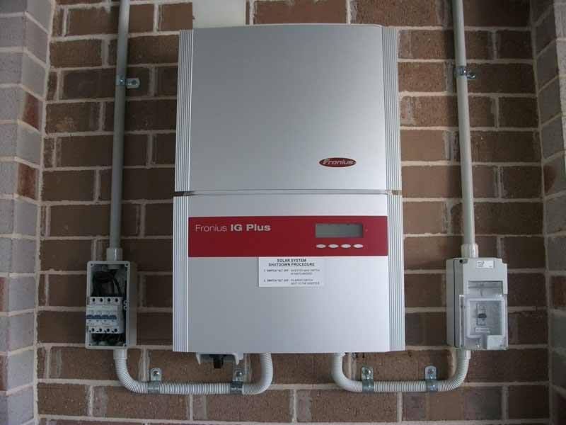 A Device On A Brick Wall That Says Fronius On It — CJ Electrical & Solar In Lake Macquarie, NSW
