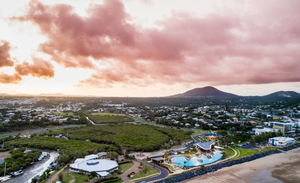 An Aerial View Of A City With A Mountain — CJ Electrical & Solar In Berkeley Vale, NSW