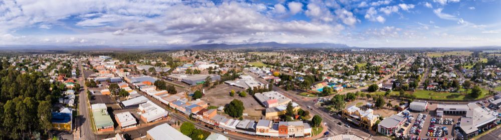 An Aerial View Of A City With Lots Of Buildings And Trees — CJ Electrical & Solar In Cessnock, NSW