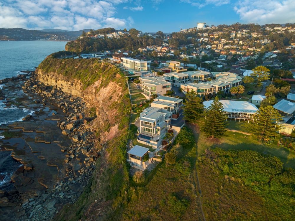 An Aerial View Of A City On A Cliff Overlooking The Ocean — CJ Electrical & Solar In Terrigal, NSW