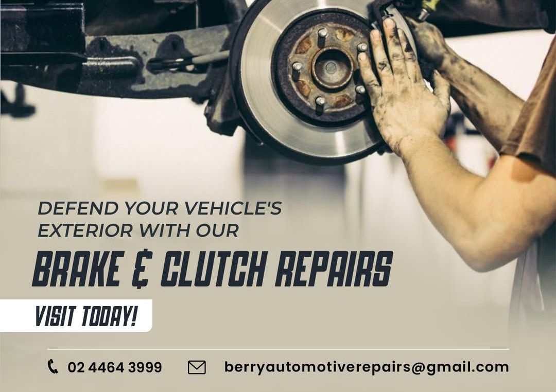 A Man Is Working On The Engine Of A Car — Berry Automotive Repairs In Berry, NSW