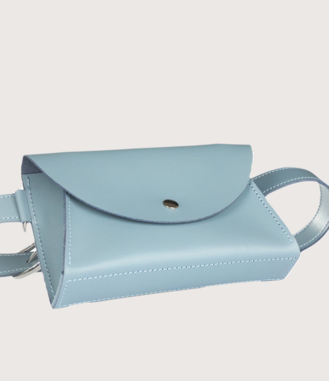 A light blue leather clutch bag with a silver button on the front.