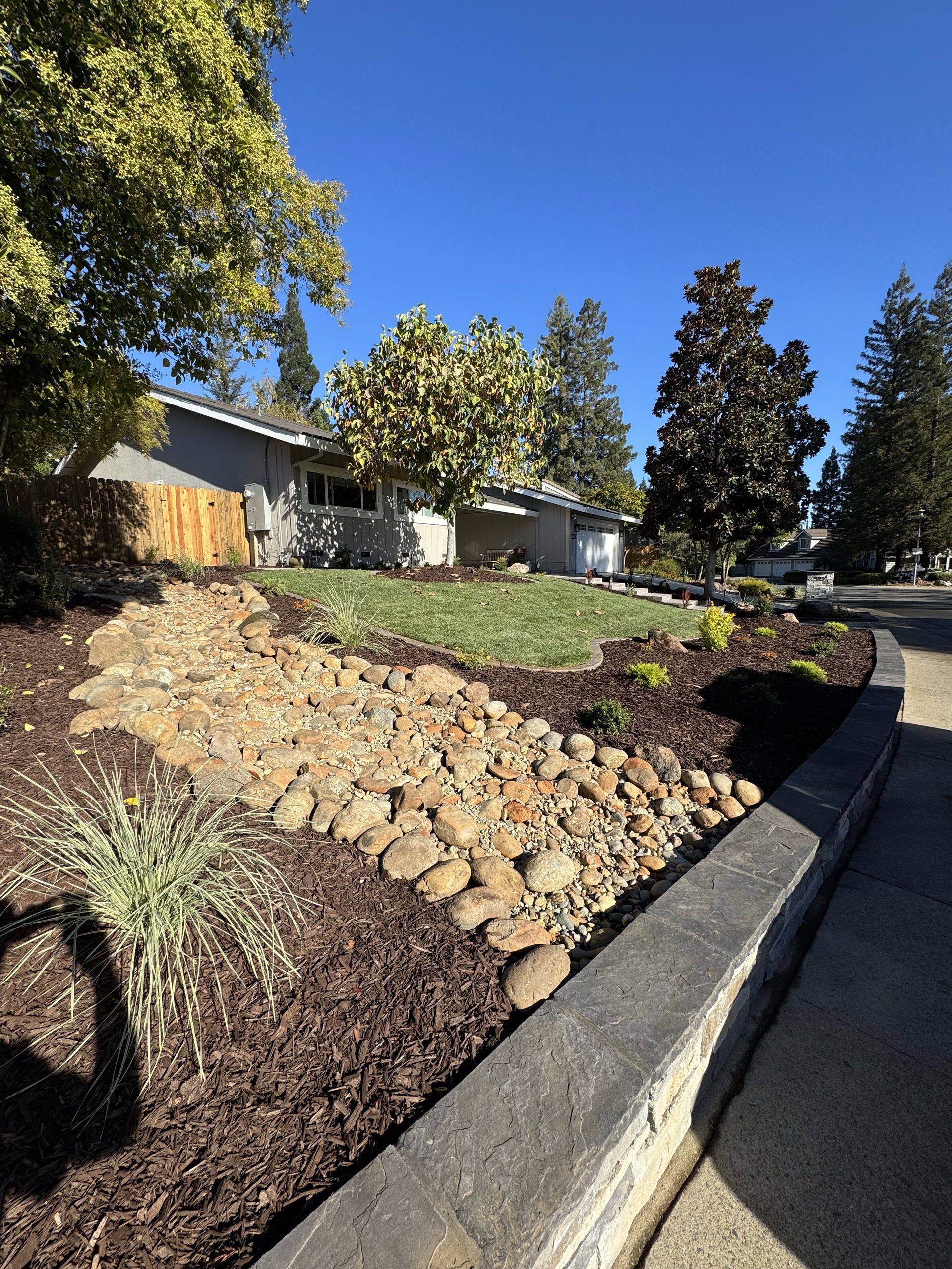 A house with a lot of rocks in front of it.