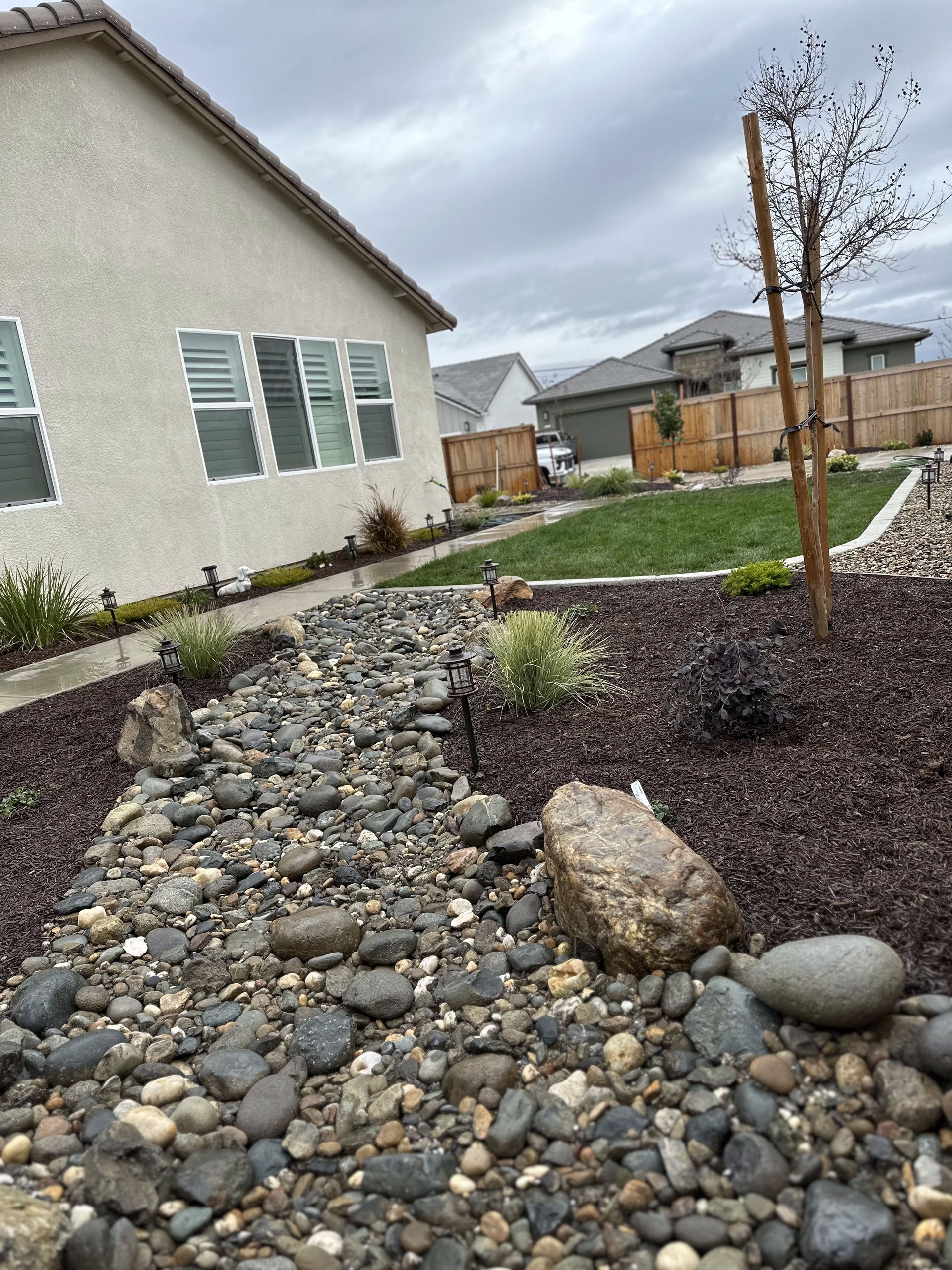 A house with a lot of rocks in front of it.