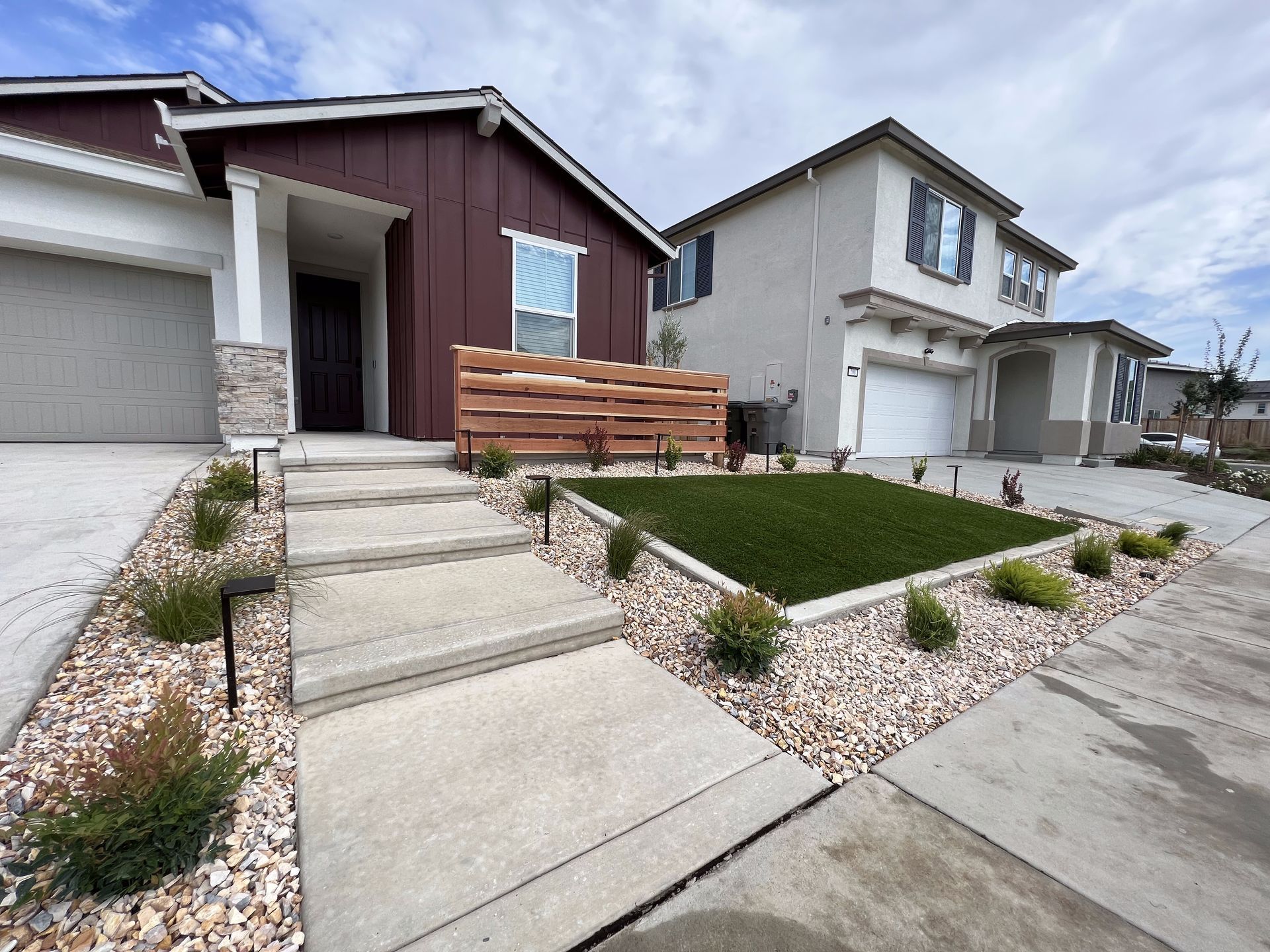 The front of a house with stairs leading up to it