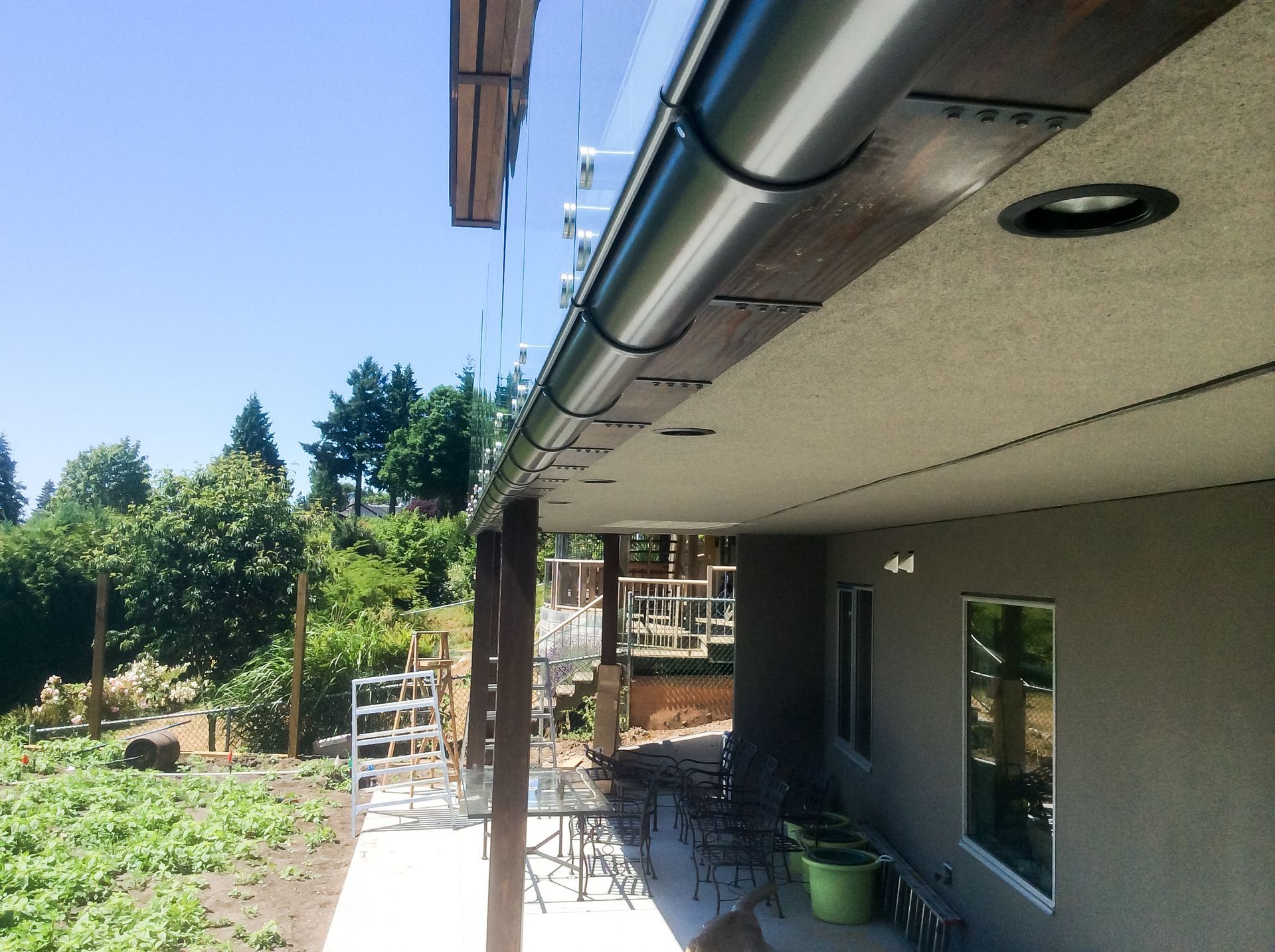 A house with a gutter on the side of it