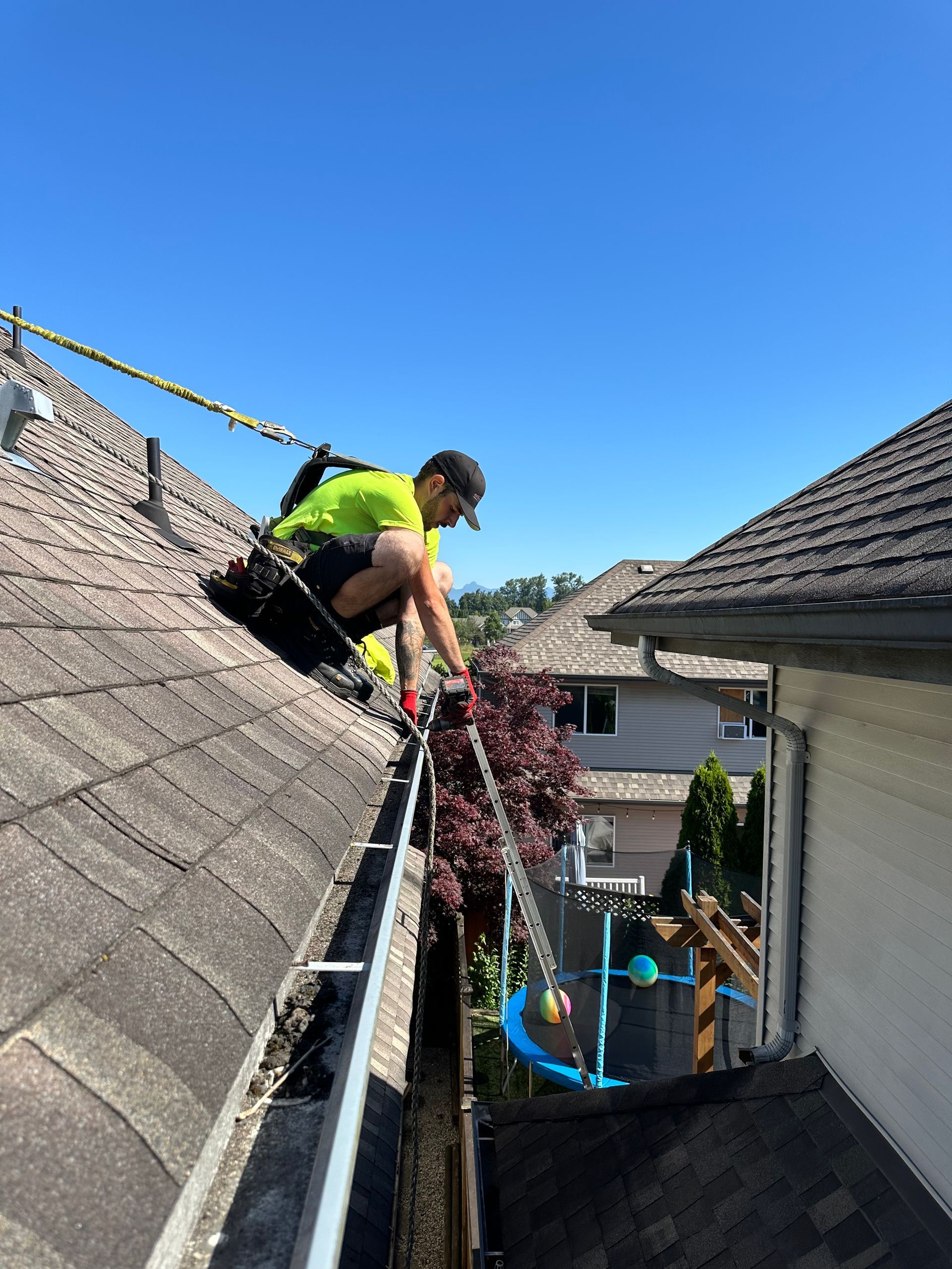 man replacing gutter