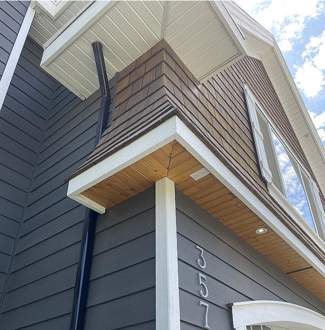 A house with a balcony on the side of it