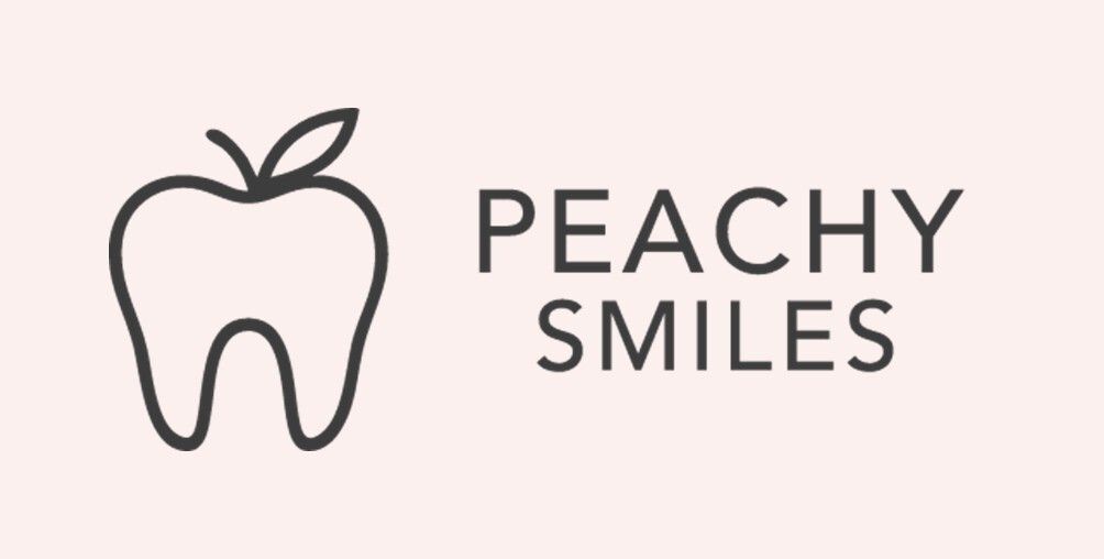 Logo with a peach outline and the text “PEACHY SMILES” on a pale pink background