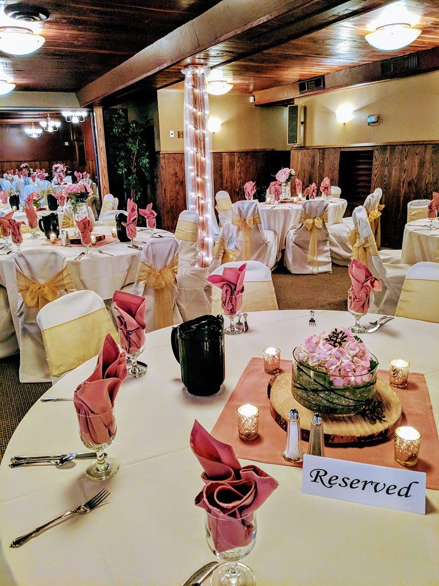 Table and chairs with gold and pink color — Fort Wayne, IN — Goeglein's Catering