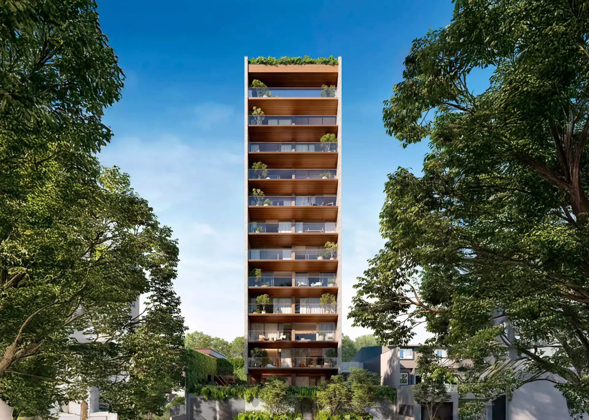 Prédio residencial alto e moderno com varandas e árvores.