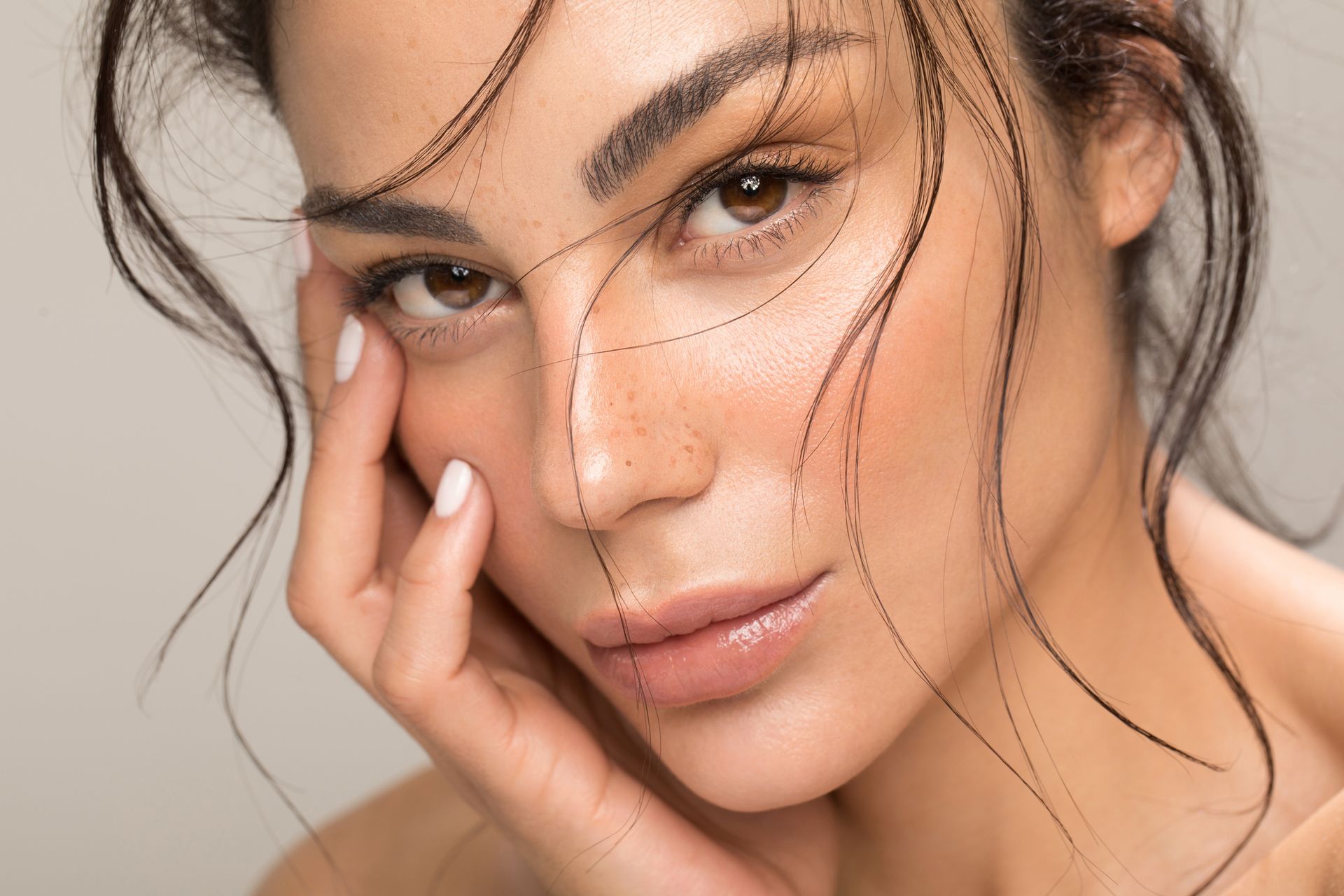 A close up of a woman 's face with lines drawn on it.