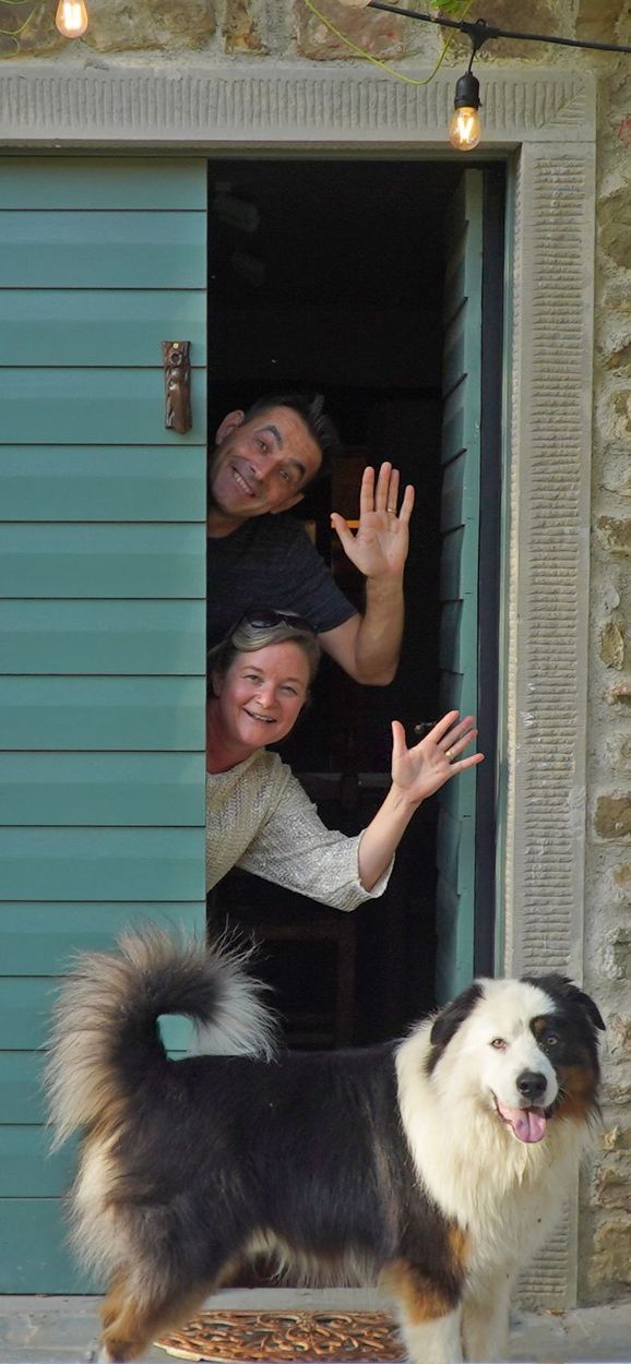 Pierre and Rebecca Gouttenoire welcoming guests at the Campo Sasso cheese-aging cellar in Tuscany
