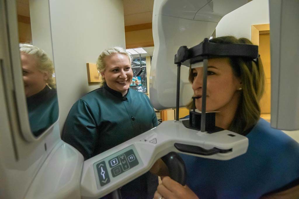general dentist in bellevue, WA giving patient dental x-rays