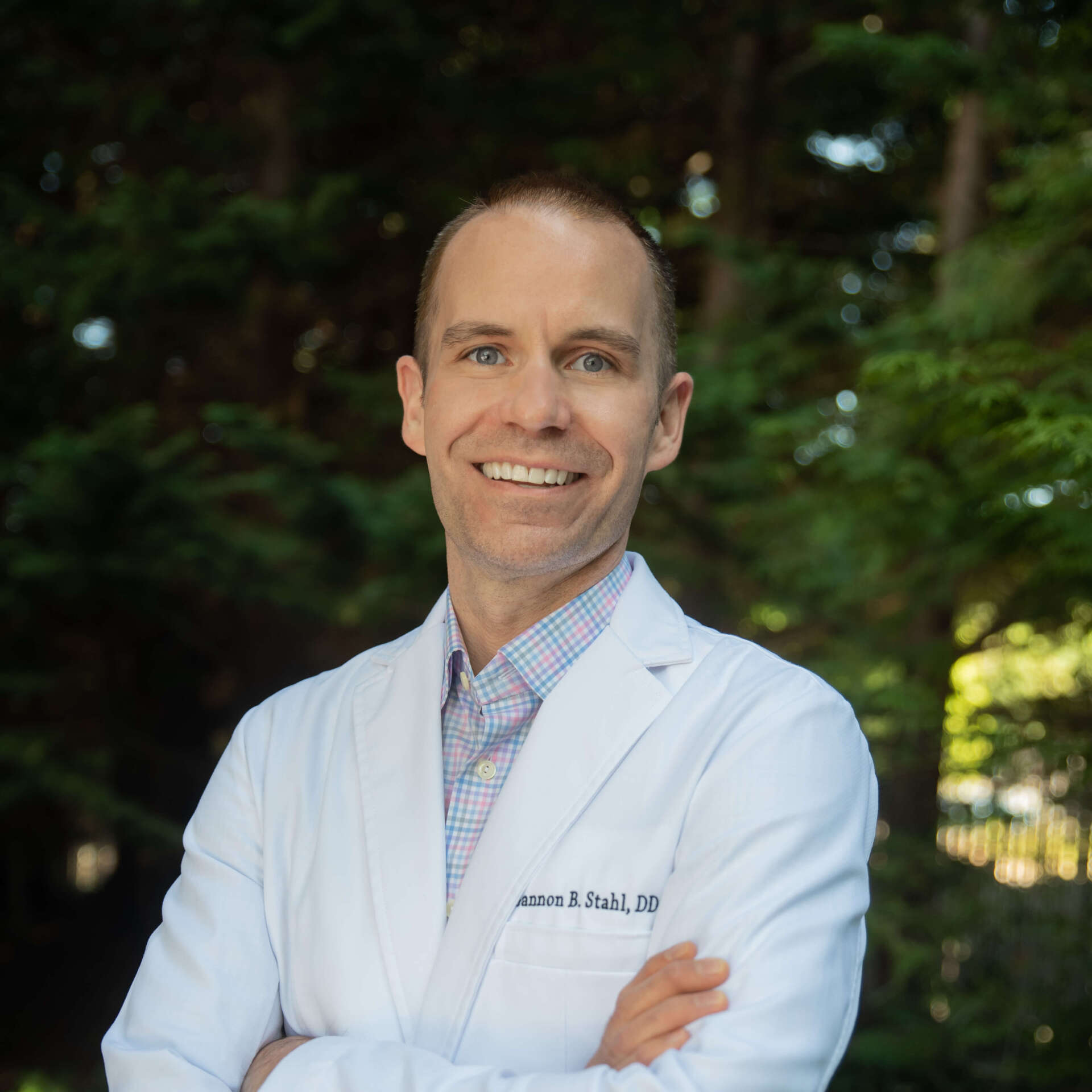Dr. Gannon Stahl, dentist in Bellevue, smiling for a picture at his dental office, Pineview Aesthetic & Family Dentistry.