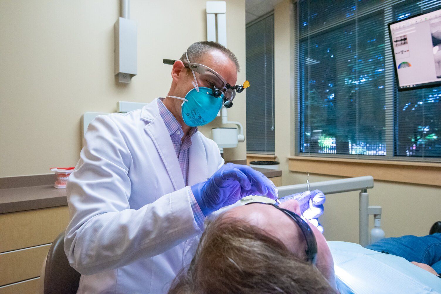Dr. Gannon Stahl, dentist in Bellevue, with a patient.