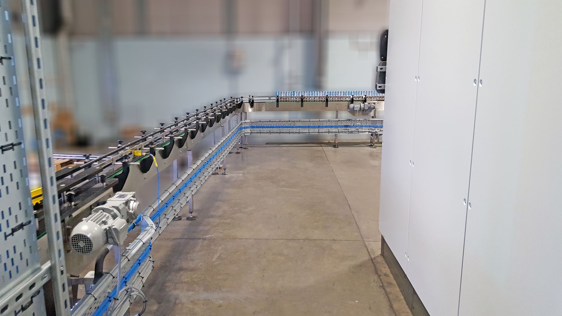 A person is using a tablet computer in a factory.