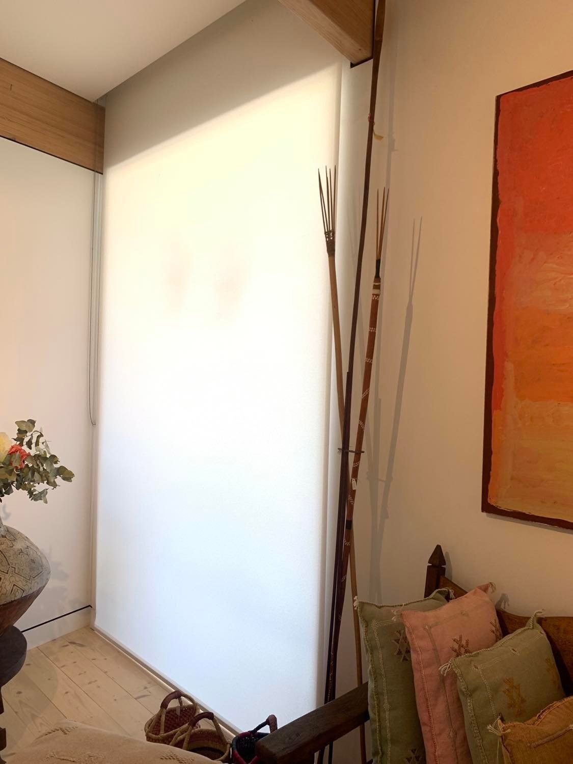 White Window Shades, Dried Sticks, Artwork and Pillows in A Corner of A Room — Alice Mobile Blinds in Ciccone, NT