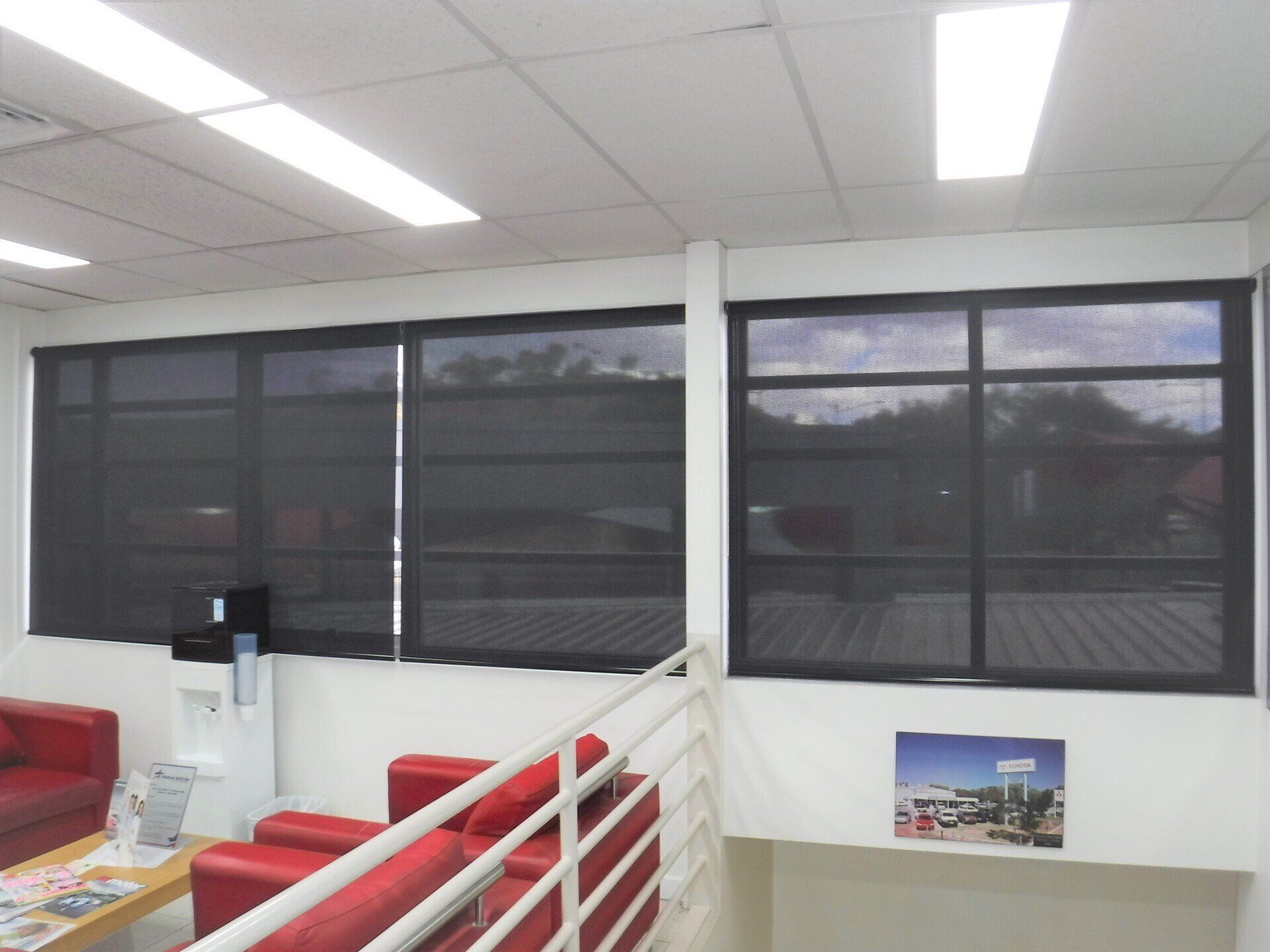 Office Interior with Dark-Tinted Windows — Alice Mobile Blinds in Ciccone, NT