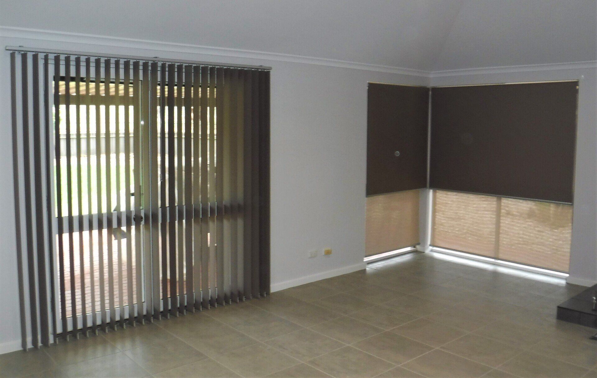 Interior View of A Room with Vertical Blinds and A Window — Alice Mobile Blinds in Ciccone, NT