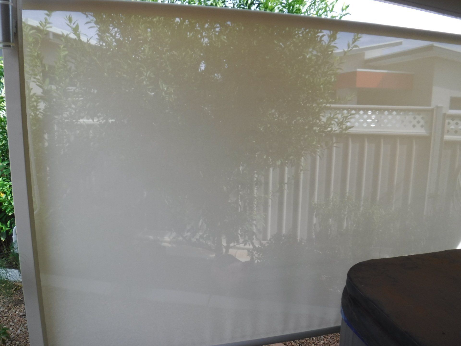 Beige Outdoor Roller Shade Partially Lowered Offering Shade — Alice Mobile Blinds in Ciccone, NT