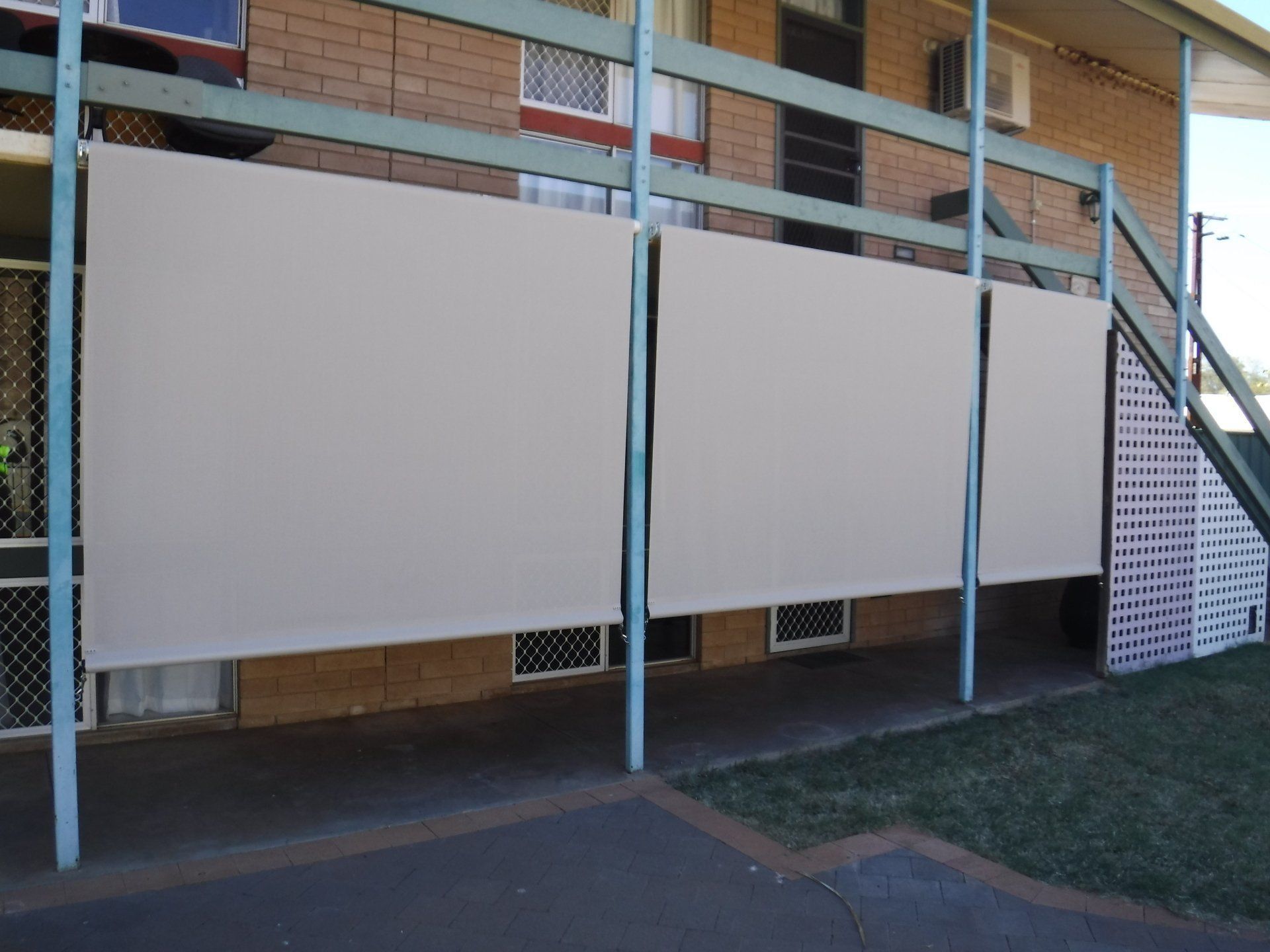 Three Beige Privacy Screens Attached to A Blue Metal Frame — Alice Mobile Blinds in Ciccone, NT