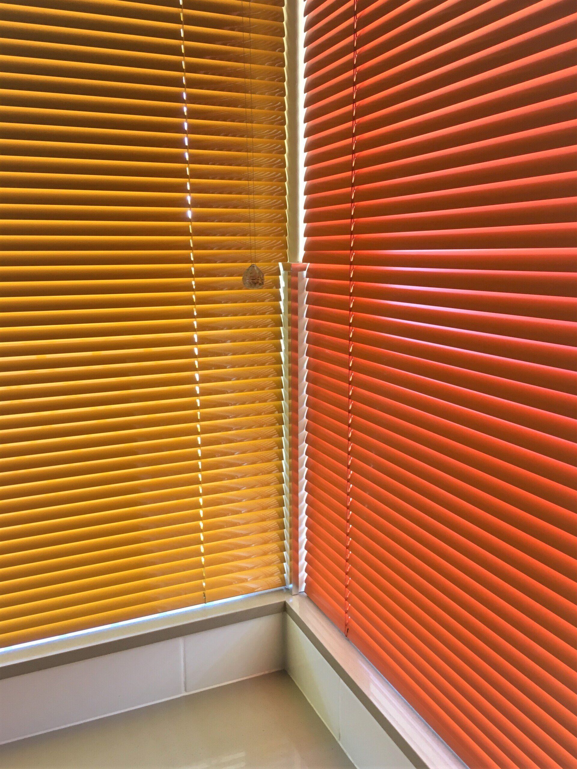 Yellow and Orange Venetian Blinds Covering Windows — Alice Mobile Blinds in Ciccone, NT