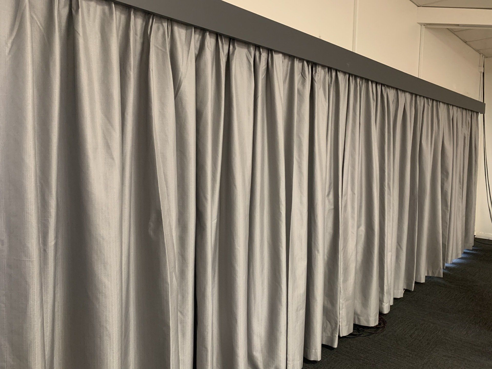 Grey Curtains Hanging from A Dark Grey Track — Alice Mobile Blinds in Ciccone, NT
