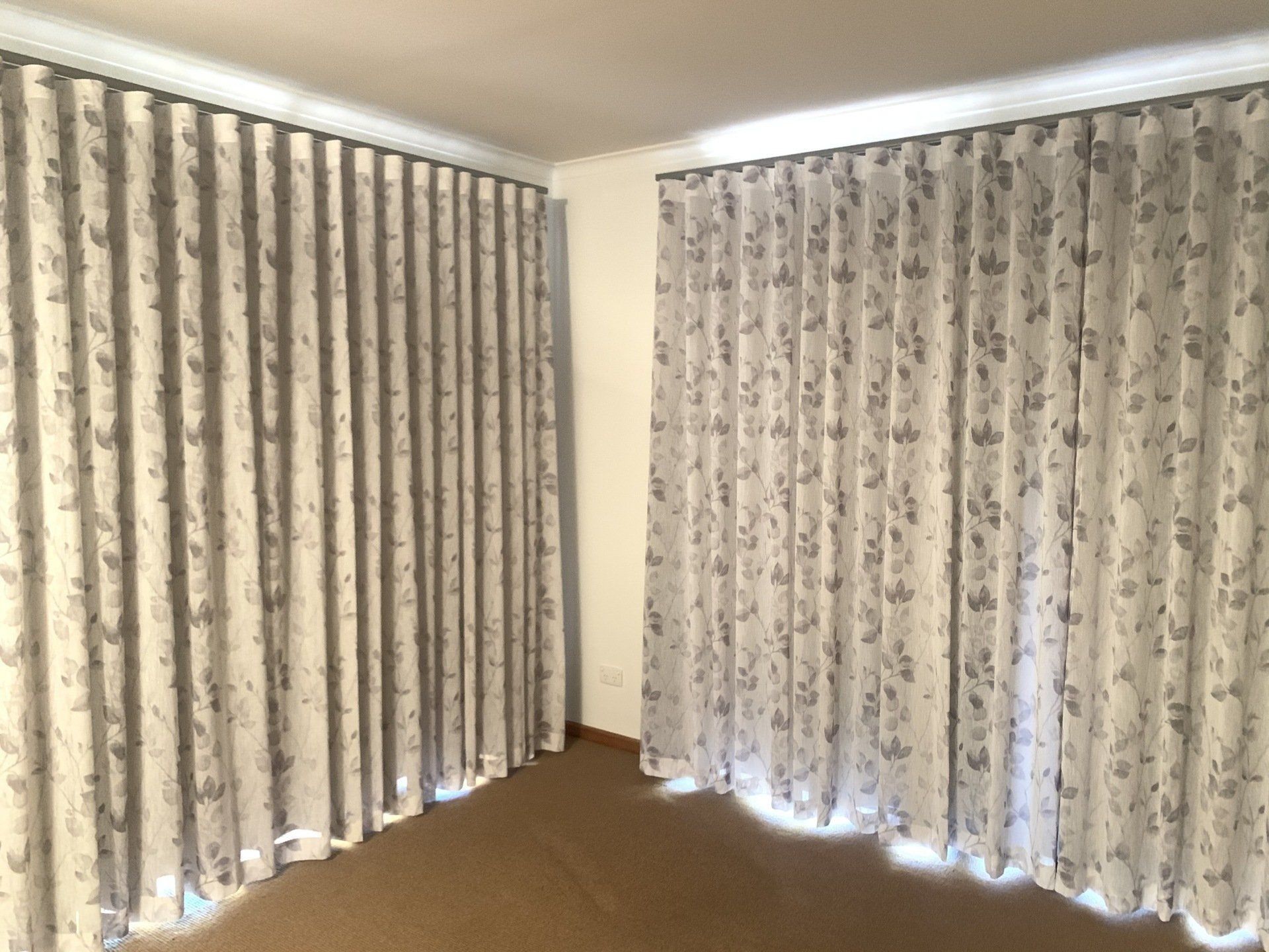 Two Light Grey Floral Patterned Curtains — Alice Mobile Blinds in Ciccone, NT