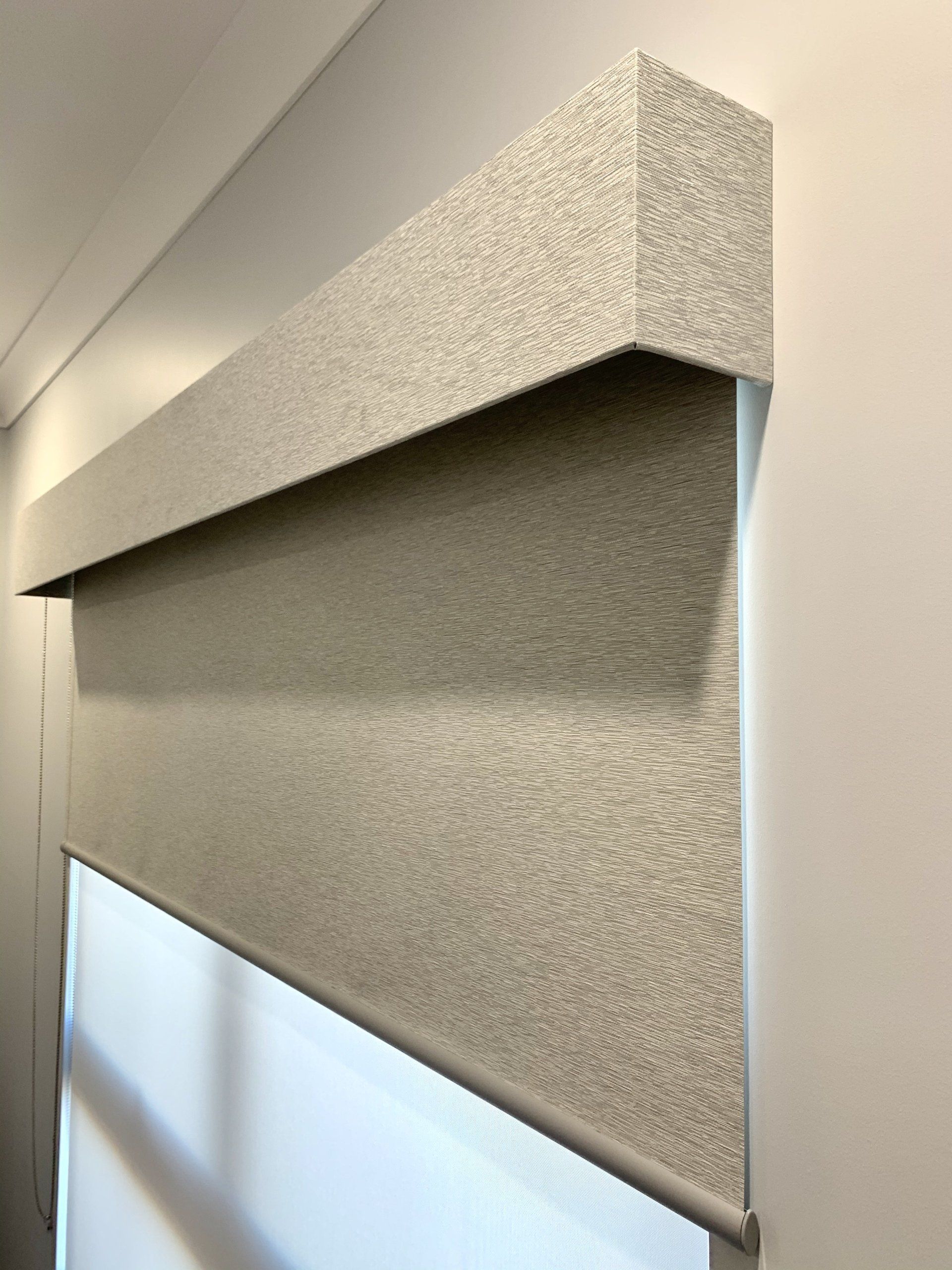 Grey Roller Blind and Matching Valance Installed on A Wall— Alice Mobile Blinds in Ciccone, NT
