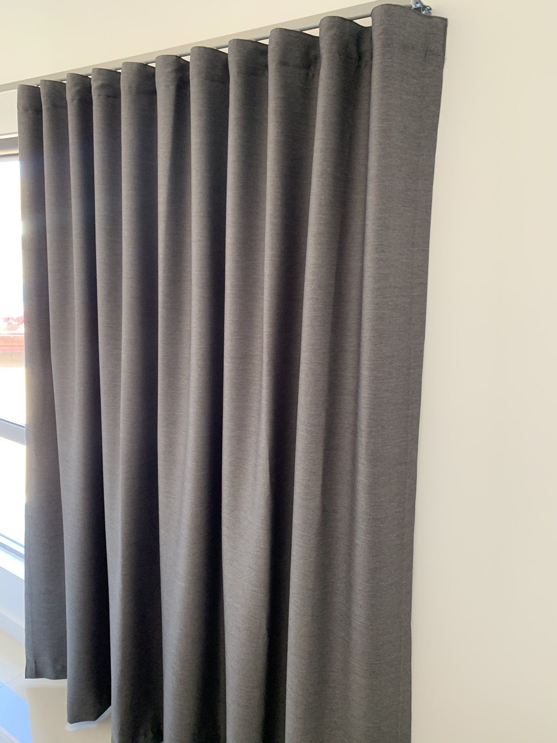 Dark Grey Curtains Hanging from A Track — Alice Mobile Blinds in Ciccone, NT